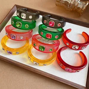 Elegant colorful resin open cuff bracelets with sparkling rhinestone embellishments for women.