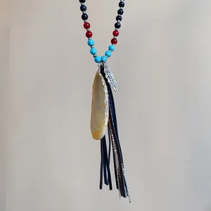 Bohemian necklace with colorful beads, natural agate stone, and leather tassels