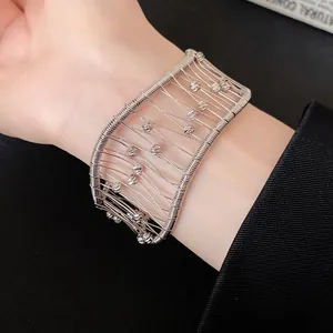 Detail view of French retro woven hollow grid cuff bracelet with beads