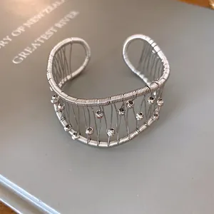 Macro view showing the intricate woven mesh and bead detail of this silver cuff bracelet