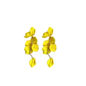 Vibrant yellow bohemian petal tassel earrings for stylish summer beach vacation outfits.
