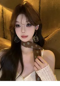 Close-up of vintage Maillard style round leopard pattern resin earrings worn by a model