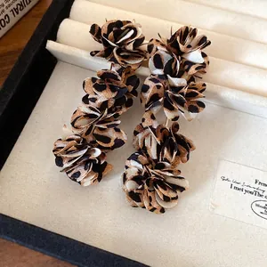 Leopard print fabric flower drop earrings in a stylish jewelry box for women