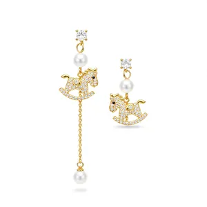 Elegant gold plated rocking horse stud earrings with pearls and cubic zirconia tassels