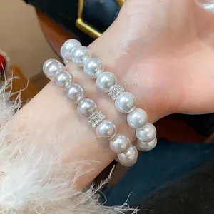 Elegant French style double-layered pearl bracelet with zircon flower charm detail