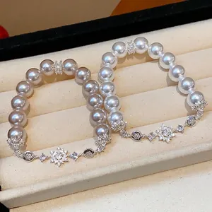 Elegant French style pearl bracelet with zircon flower charms in white and grey pearls