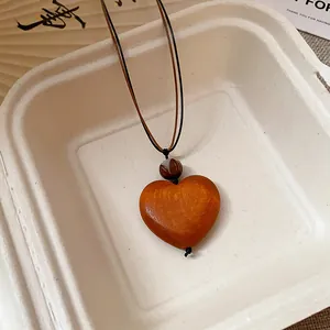 Vintage ethnic style wooden heart pendant necklace with Zen beads and brown cords