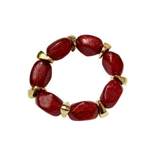 Elegant red glitter acrylic oval beaded bracelet with gold-toned spacers for women