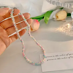 Close-up detail of a colorful woven seed bead necklace with an adjustable metal chain