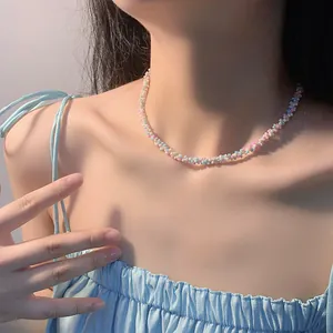 Detailed view of colorful beaded woven choker on model under soft natural light