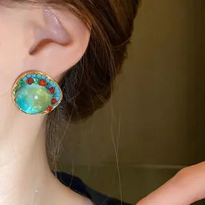 Vintage palace style round stud earrings with large green stone and colorful crystals