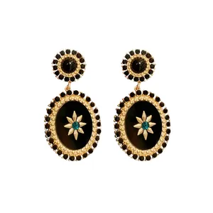 Vintage palace style oval drop earrings with black rhinestones and teal star center