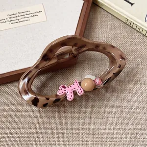 Elegant leopard print hair claw clip with cute pink dog and bead ornaments for women