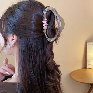 Leopard print hair claw clip with cute pink dog decoration for sweet and elegant hair styling