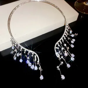 Detailed view of teardrop rhinestone fringe on a luxury silver-toned choker necklace