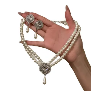 French vintage double-strand pearl necklace and teardrop earring set with rhinestones