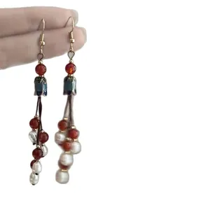 Vintage Bohemian enamel tassel earrings featuring red glass beads and white pearl accents