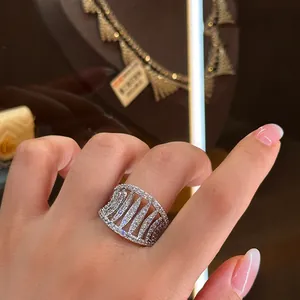Close-up detail of luxury cubic zirconia hollow out ring on finger