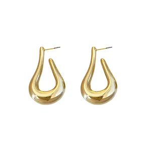 Elegantes pendientes de botón geométricos retorcidos en forma de U dorados para mujer