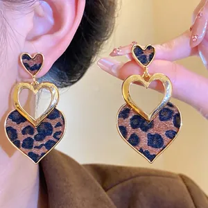 Elegant leopard print heart-shaped dangle earrings with golden hollow accents for women