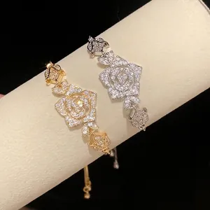 Elegant vintage flower bracelet with sparkling zircons in gold and silver tones