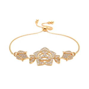 Elegant gold-tone vintage flower bracelet with sparkling cubic zirconia and adjustable slide closure.