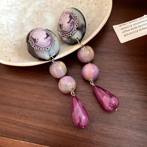 Vintage palace style cameo drop earrings with purple resin teardrop and iridescent beads