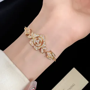 Exquisite close-up of a vintage gold flower bracelet encrusted with sparkling zircon crystals