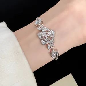 Elegant vintage floral charm bracelet featuring sparkling zircons on a silver band