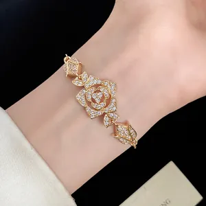 Detailed shot of vintage golden bracelet with sparkling zircon rose petals