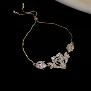 Detailed view of a retro zircon rose flower bracelet with sparkling stones on black