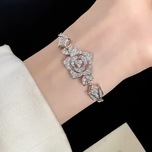 Close-up of elegant rose flower bracelet with sparkling zircon stones on wrist