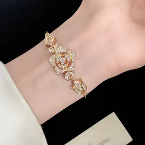 Close-up of a vintage-style gold rose bracelet with sparkling zircon stones on a wrist