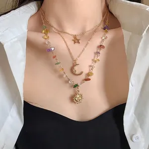 Vintage layered celestial necklace with sun moon star charms and colorful stones