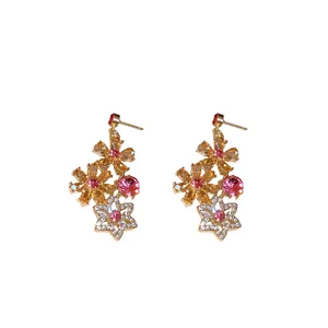 Vintage gold-tone floral dangle earrings encrusted with pink and champagne crystals