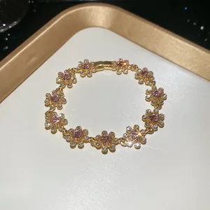 Close-up of vintage French gold floral bracelet with sparkling pink rhinestones