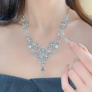 Detailed close-up of a vintage floral hollow necklace with shimmering rhinestones for women.