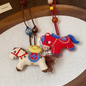 Exquisite handmade embroidered horse necklace featuring wooden beads and resin accents