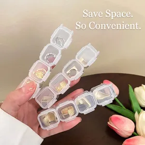 Organizador de joyas transparente con múltiples compartimentos para pendientes y anillos