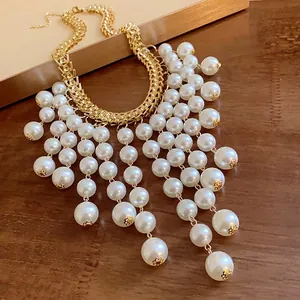Elegant vintage French style pearl tassel necklace with chunky gold chain for women.