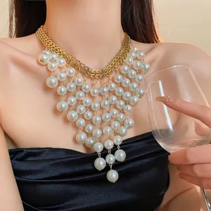 Elegant French style multi-layer pearl fringe necklace with gold chevron chain on model