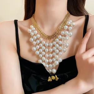 Detailed view of a multi-layer pearl fringe necklace in elegant French court style