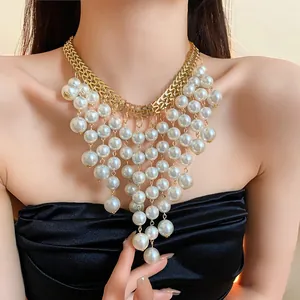 Close-up detail of French luxury multi-tier pearl fringe bib necklace with gold-tone chain