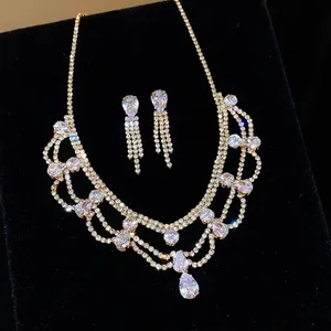 Elegant waterdrop shaped crystal necklace and earrings jewelry set in gold tone for women