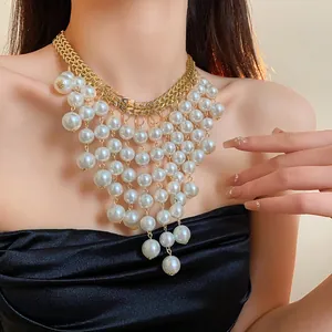Detailed close-up of a French luxury pearl tassel necklace worn on a model's neck