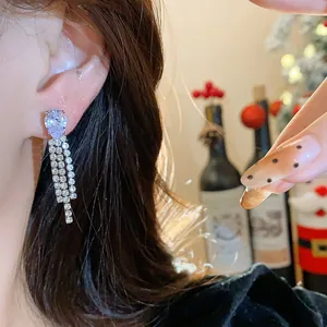 Elegant silver-tone tassel drop earrings featuring a sparkling pear-shaped waterdrop crystal