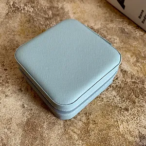 Premium portable light blue Saffiano leather jewelry storage box with secure zipper