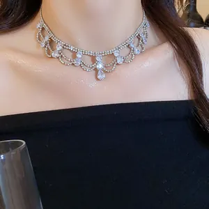 Close-up detail of luxury rhinestone choker necklace with pear-shaped water drop pendants