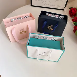 Set of three elegant jewelry gift bags and boxes in pink navy and teal colors