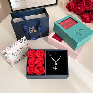 Detailed view of an elegant rose jewelry gift box set including a necklace and ring